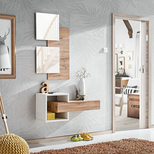 Modern interior design with wall-mounted shelves, framed pictures, and a mirror.
