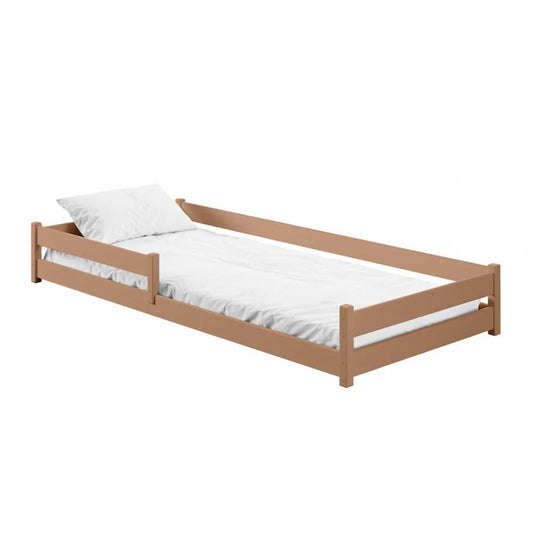 Wooden bed with white mattress and pillow on a white background