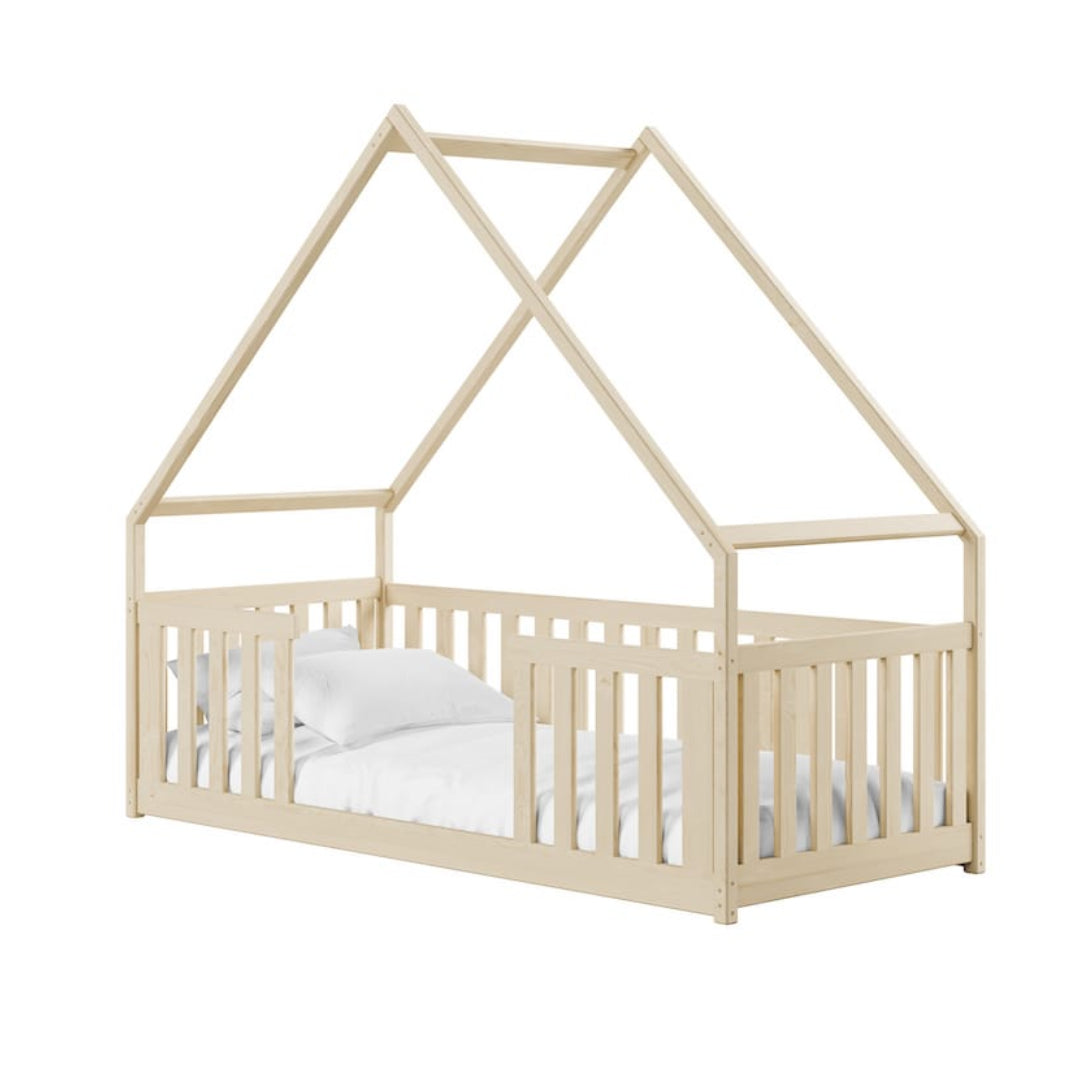 Beige children's crib with a house-shaped top on a white background