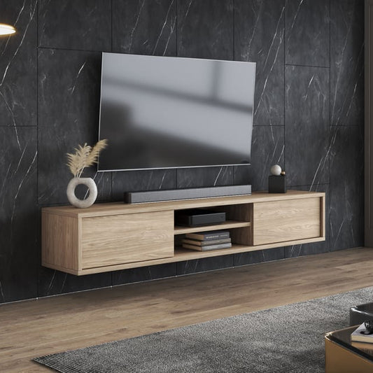 Modern living room with a television on a wooden stand against a dark marble wall.