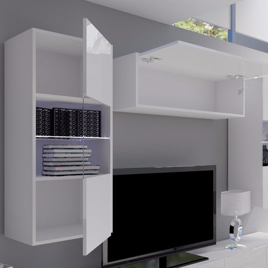 Modern white entertainment center with shelves and a TV in a living room setting.