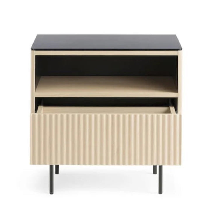 Small cabinet with black top and beige body on a white background