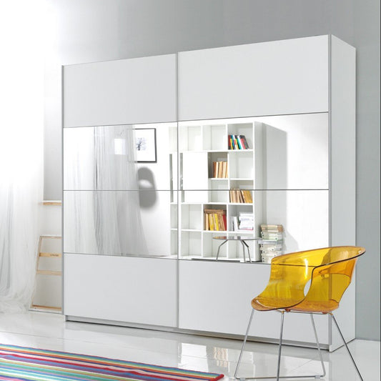 Modern interior design with a white wall unit, colorful rug, and yellow chair.