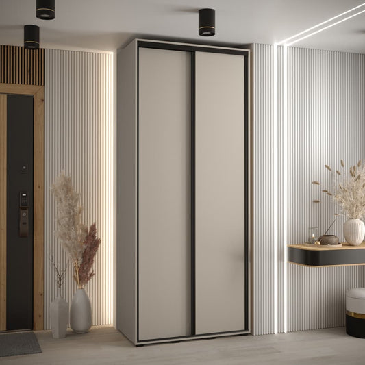 Modern wardrobe with sliding doors in a room with decorative elements.
