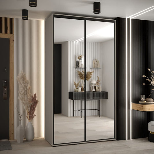 Modern interior design with a large mirror and decorative elements.