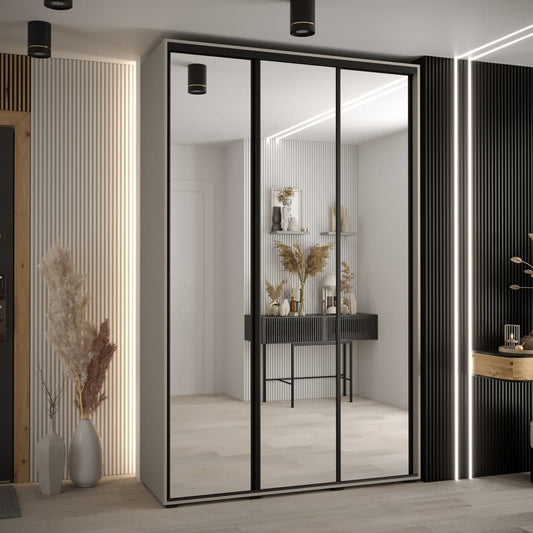 Modern interior design with a wardrobe featuring sliding glass doors.