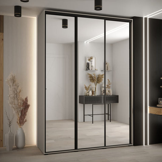 Modern wardrobe with sliding glass doors in a stylish interior setting.