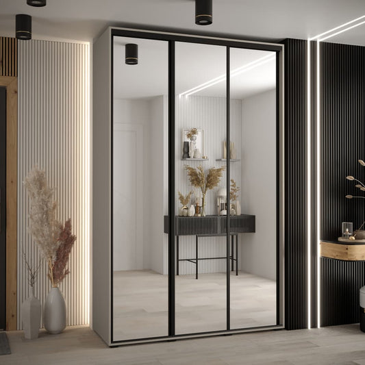 Modern interior design with a wardrobe featuring sliding glass doors.