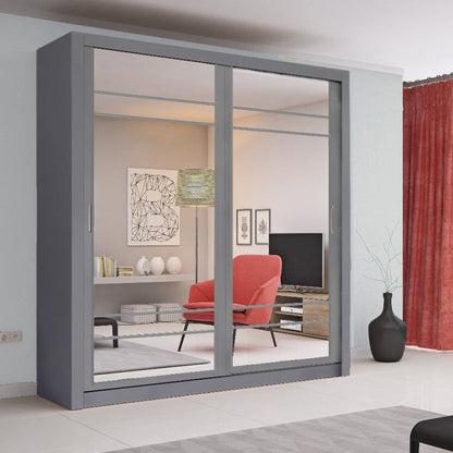 Gray sliding wardrobe with mirror doors in a living room setting.