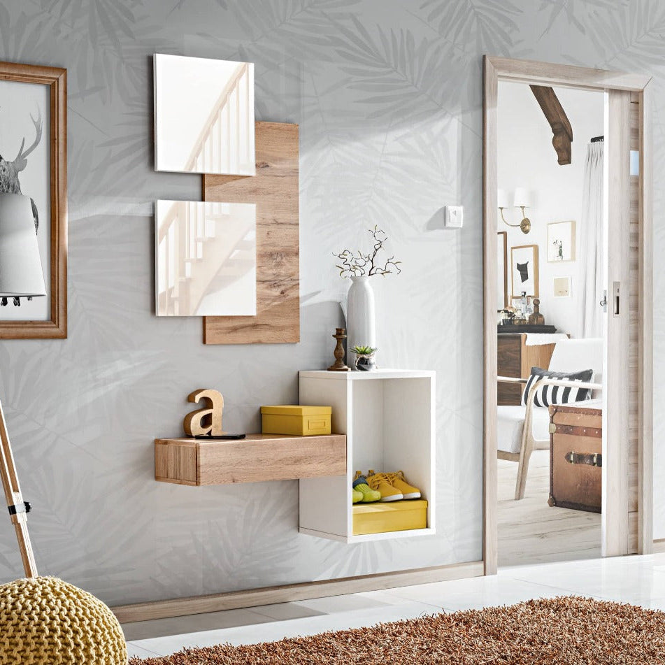 Modern interior design with wall art, shelves, and a large mirror.