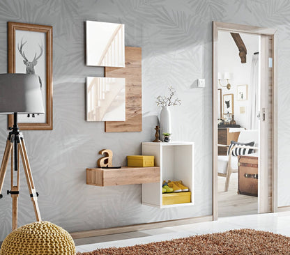 Modern interior design with wall art, shelves, and a large mirror.