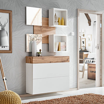 Modern interior design with white wall-mounted shelves, wooden accents, and a mirror.