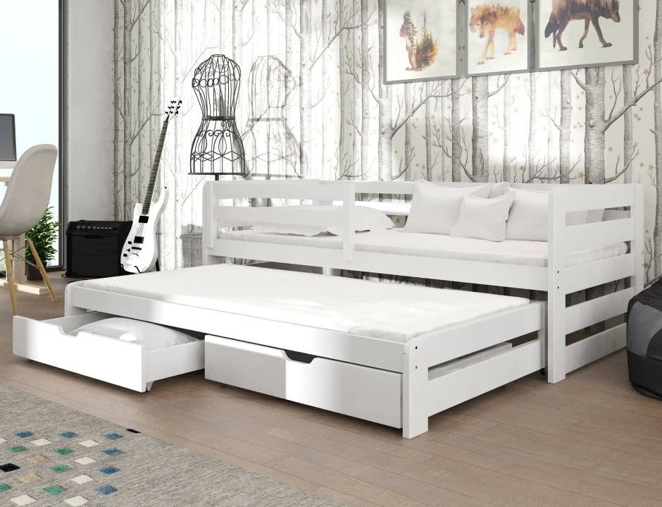 White trundle bed in a room with a guitar, chair, and wall art.