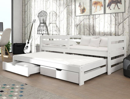 White trundle bed in a room with a guitar, chair, and wall art.