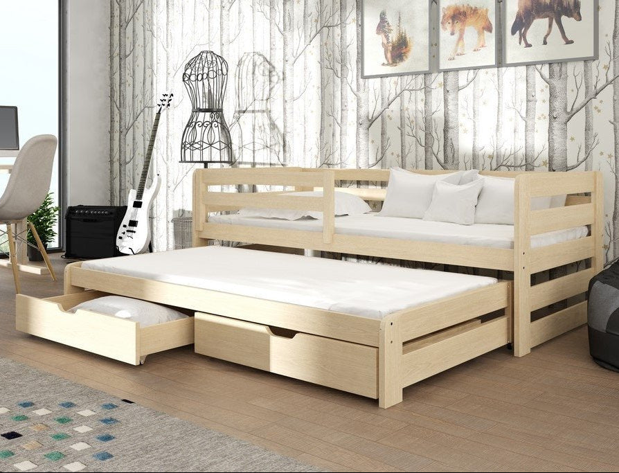 Wooden bed with pull-out trundle in a room with a guitar, chair, and decor.