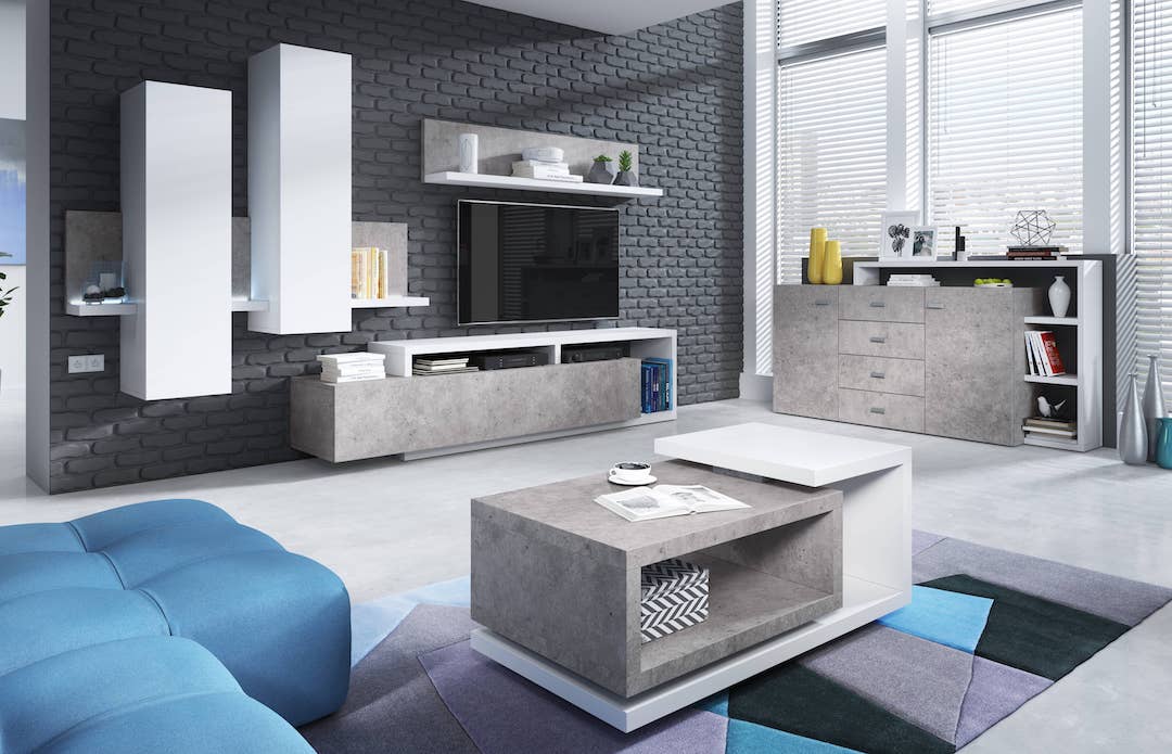 Modern living room with gray and white furniture, blue sofa, and decorative items.