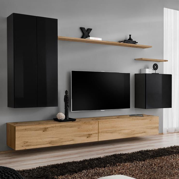 Modern living room with wooden TV stand, black cabinets, and a television.