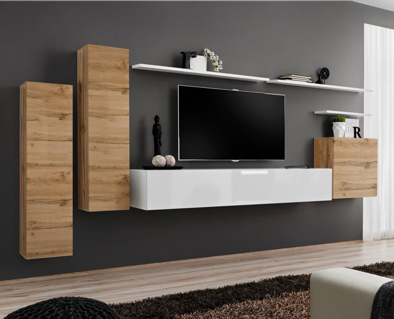 Modern living room with wooden and white entertainment unit, TV, and sofa.