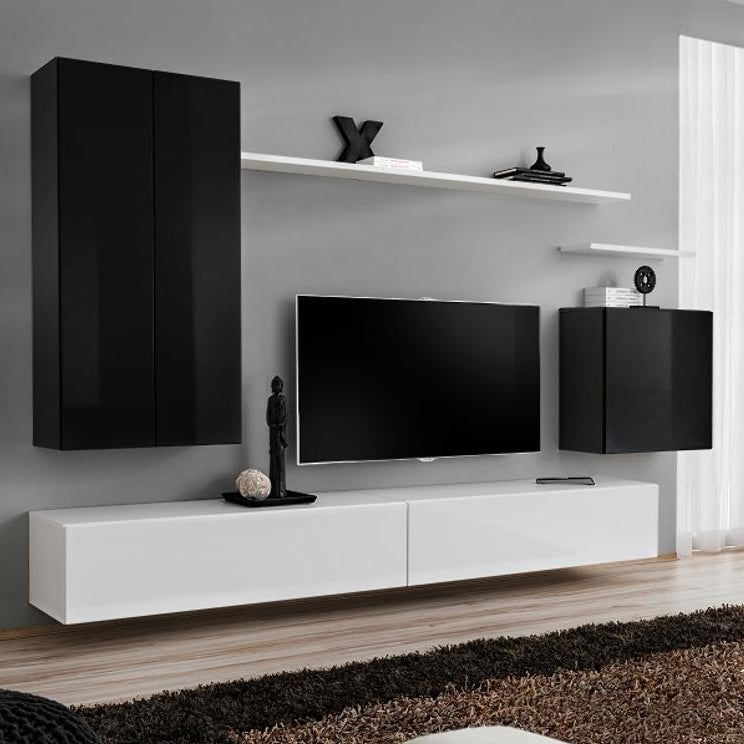 Modern living room with black and white furniture, including a TV stand and cabinets.
