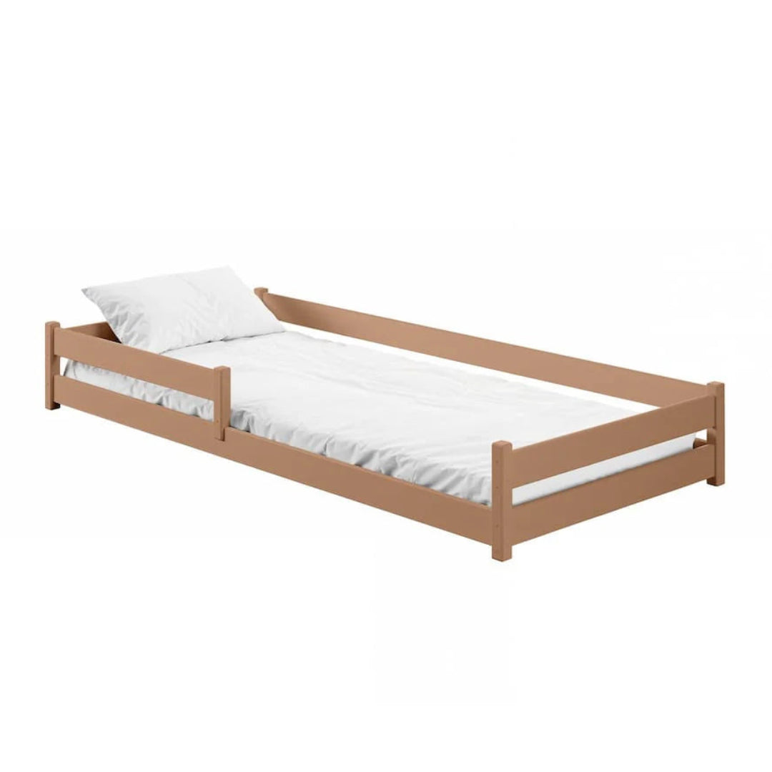 Wooden bed with white mattress and pillow on a white background