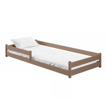 Wooden bed frame with white mattress and pillow on a white background