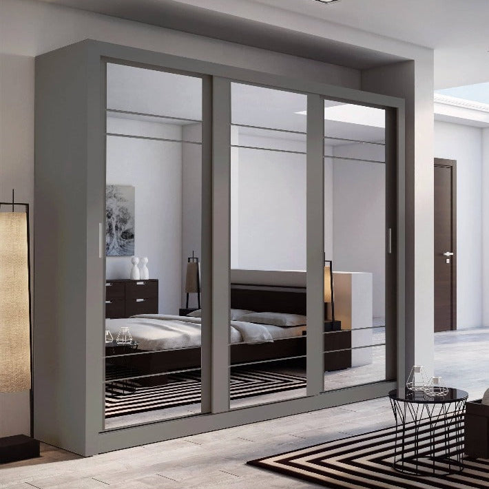 Modern bedroom with a large wardrobe and bed.