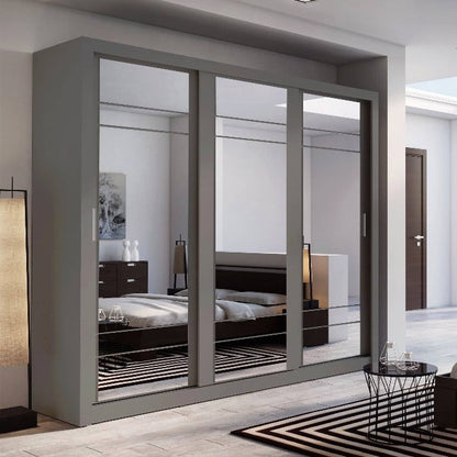 Modern bedroom with a large wardrobe and bed.