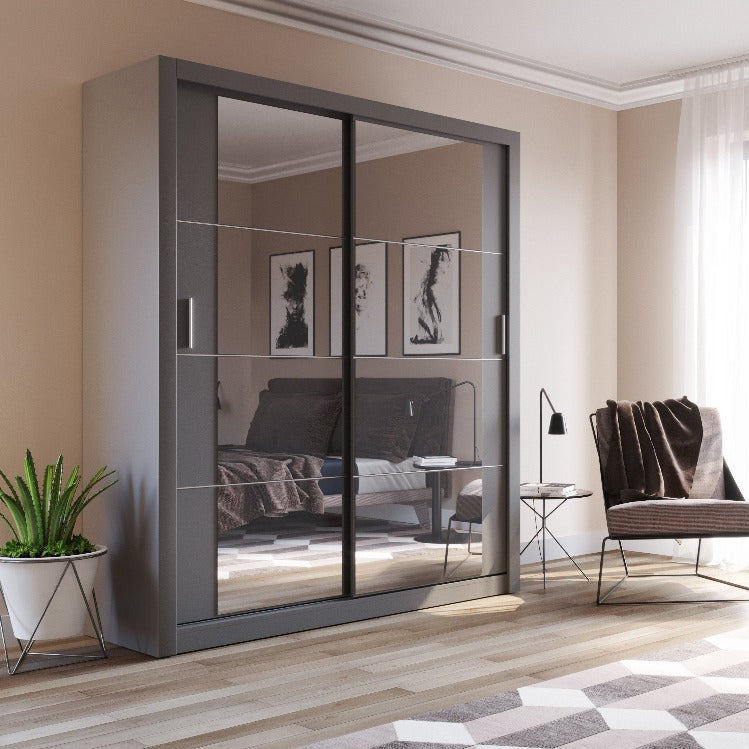 Modern bedroom with a sliding wardrobe, bed, and chair.