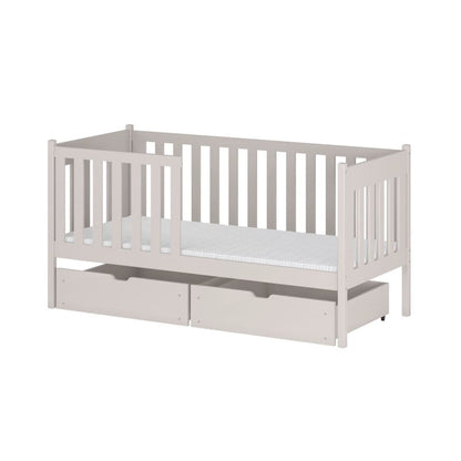 White crib with a trundle on a white background