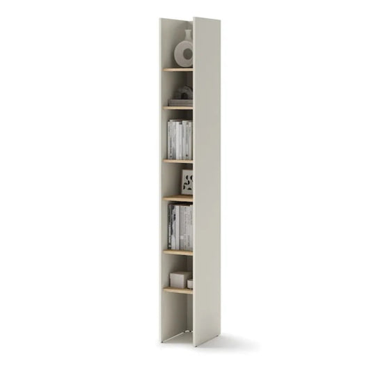 Tall narrow bookshelf with books and decorative items on a white background