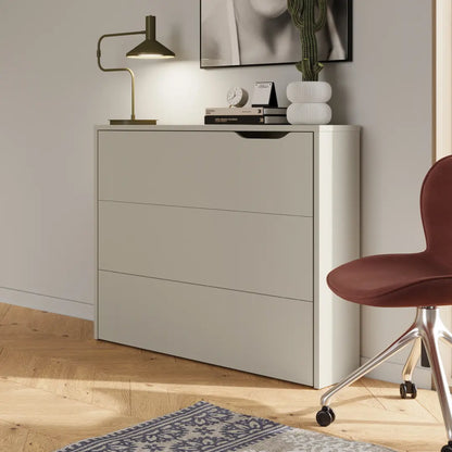 Light gray filing cabinet with a red chair in a room setting