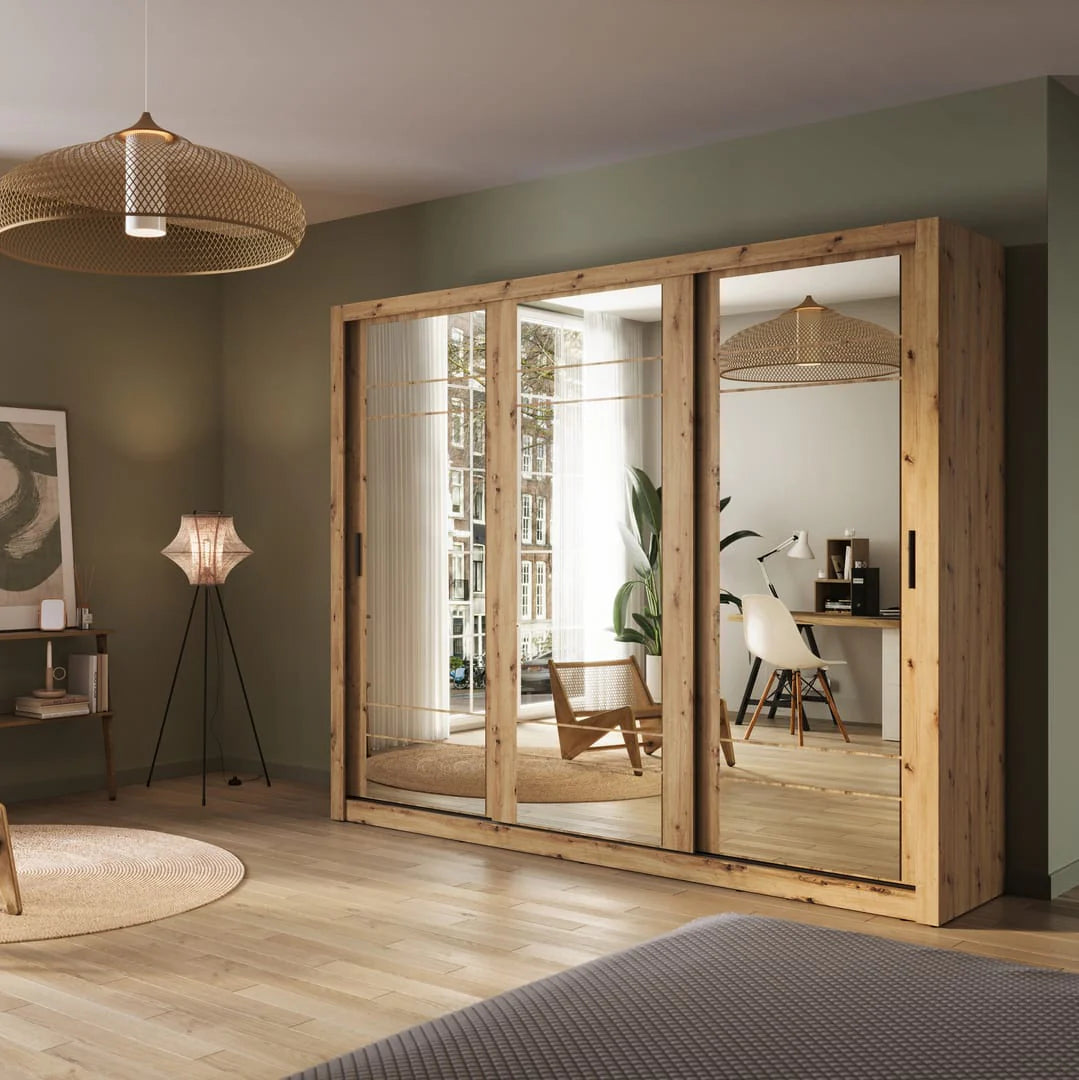 Large wooden wardrobe with mirrors in a room with a lamp and plant.
