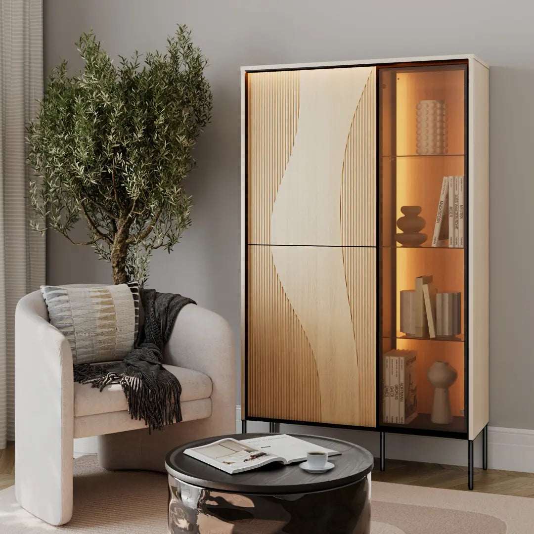 Modern living room with a stylish cabinet, armchair, and decorative items.