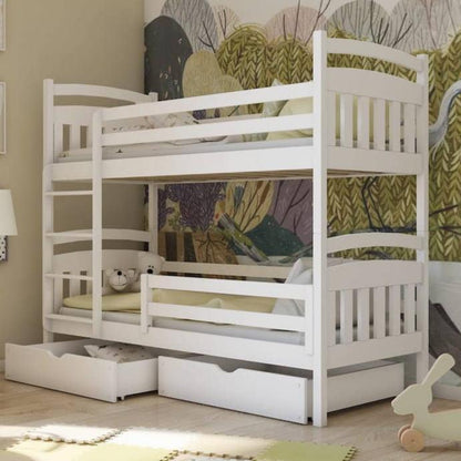 White bunk bed with drawers in a room with a colorful wall tapestry.