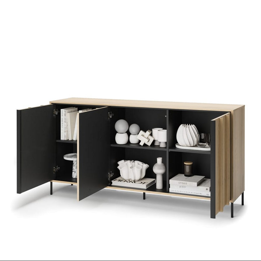 Modern cabinet with open doors displaying decorative items on a white background
