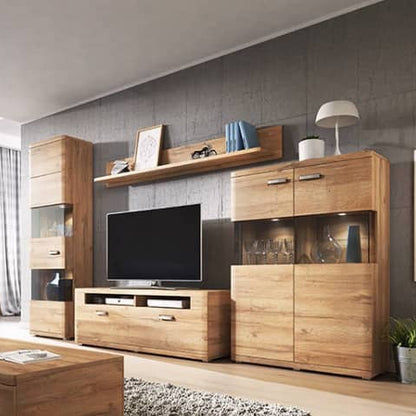 Modern living room with wooden entertainment center and blue sofa