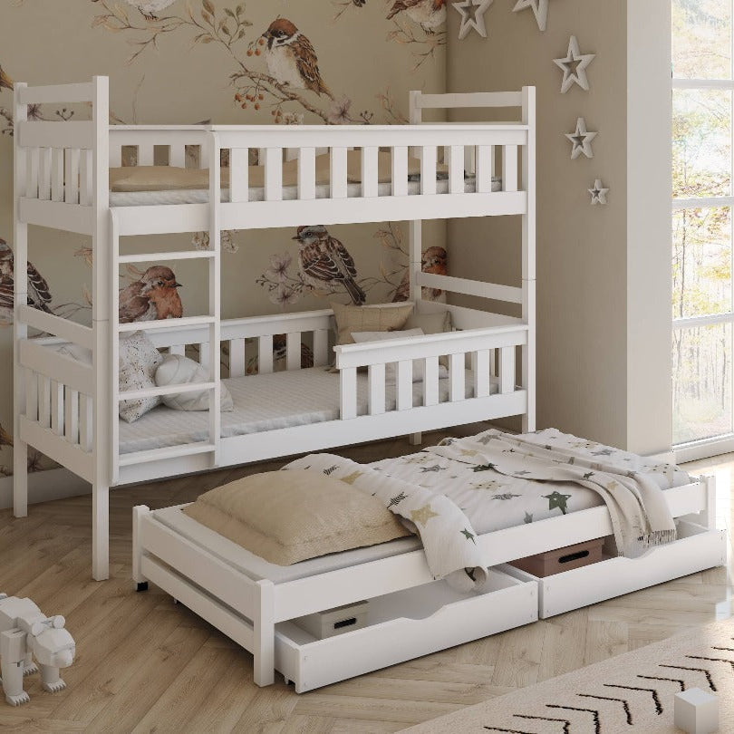 White bunk bed with pull-out drawer in a room with floral wallpaper and large windows.