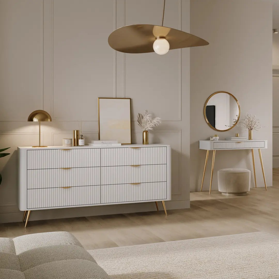 Modern bedroom with a dresser, mirror, and decorative items.