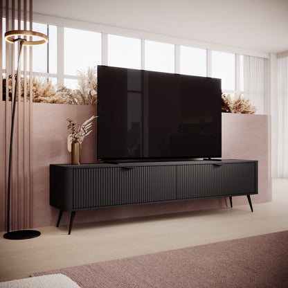 Modern living room with a black TV stand and television