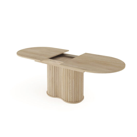 Wooden dining table with two extendable leaves on a white background