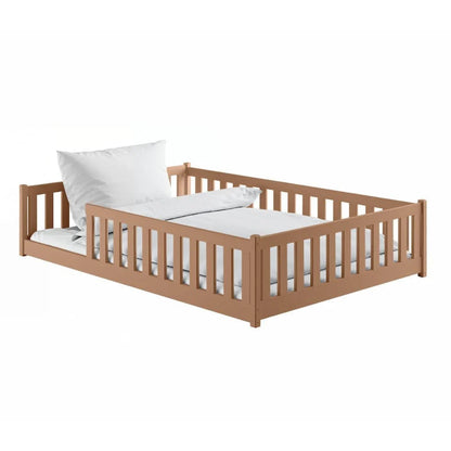 Wooden children's bed with white bedding on a white background