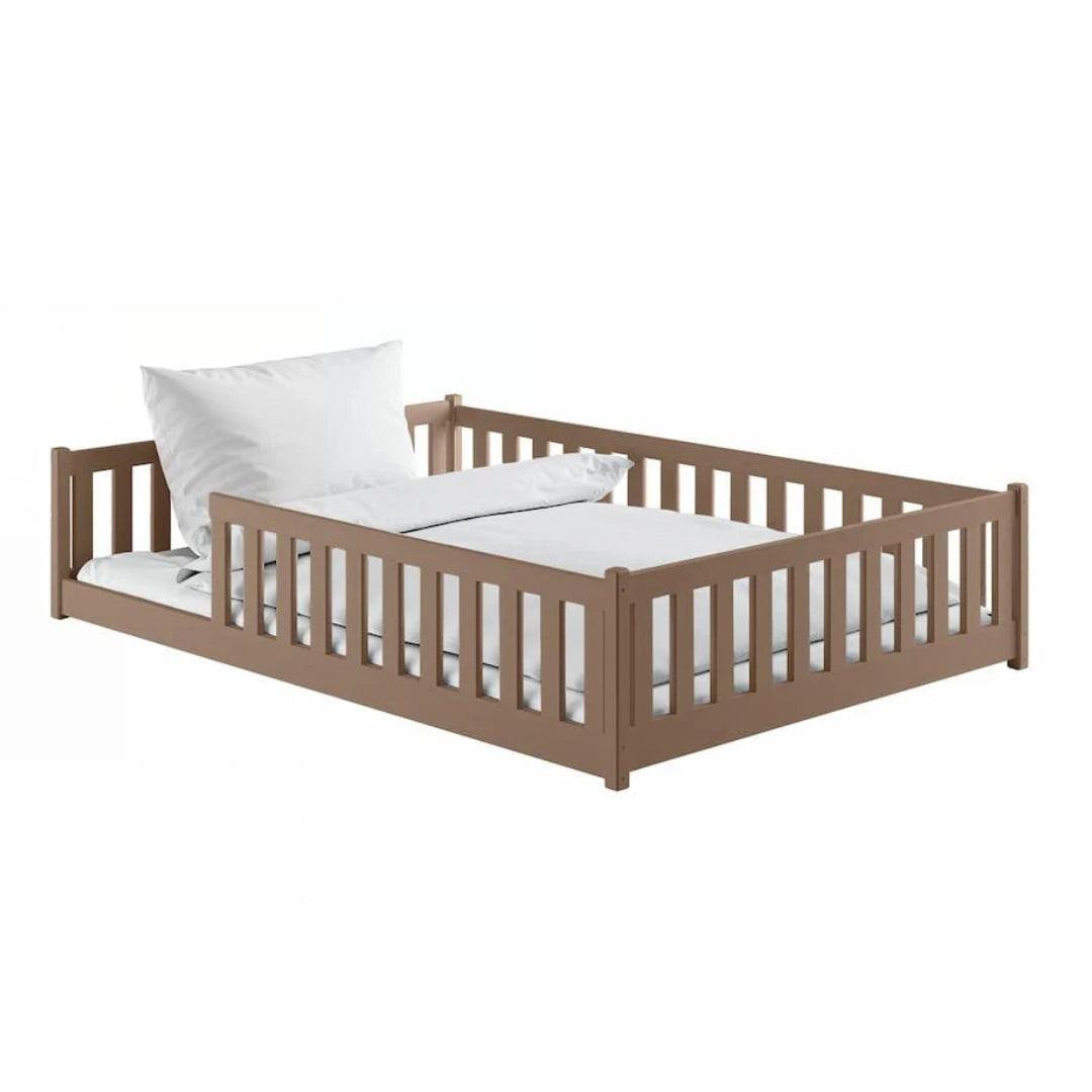 Wooden crib with white bedding on a white background