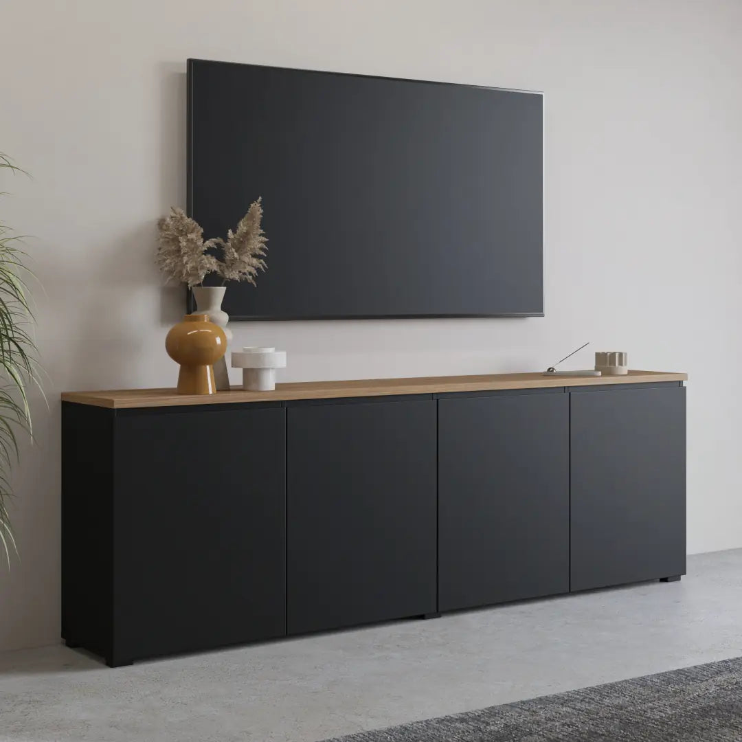 Modern black sideboard with wooden top against a white wall