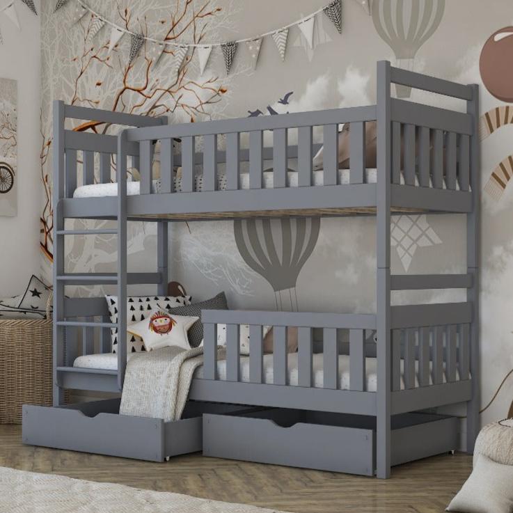 Gray bunk bed with storage drawers in a room setting.