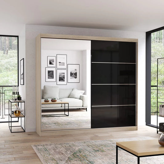 Modern sliding wardrobe with black glass panels in a living room setting