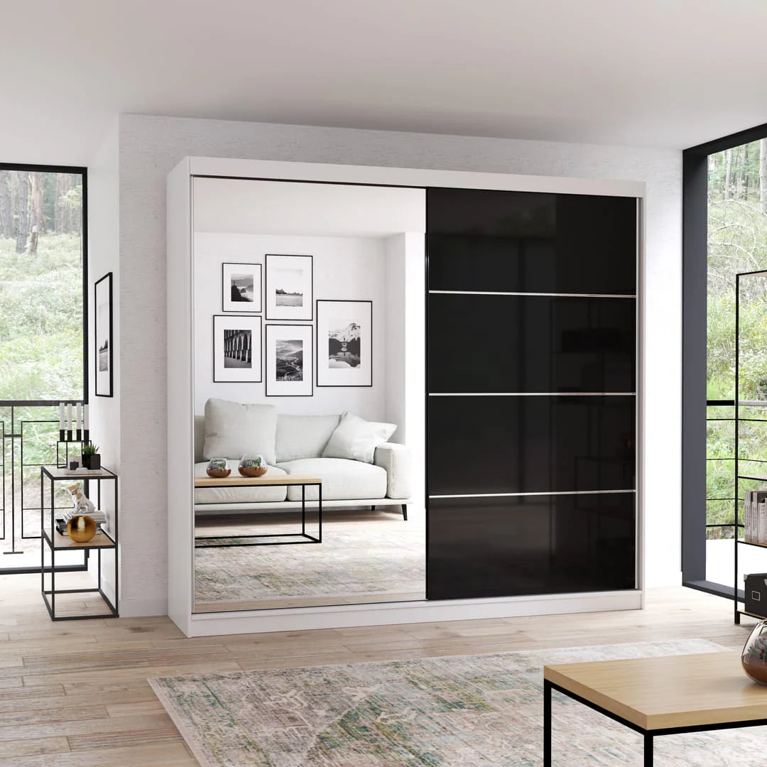 Modern sliding wardrobe with black and white design in a living room setting