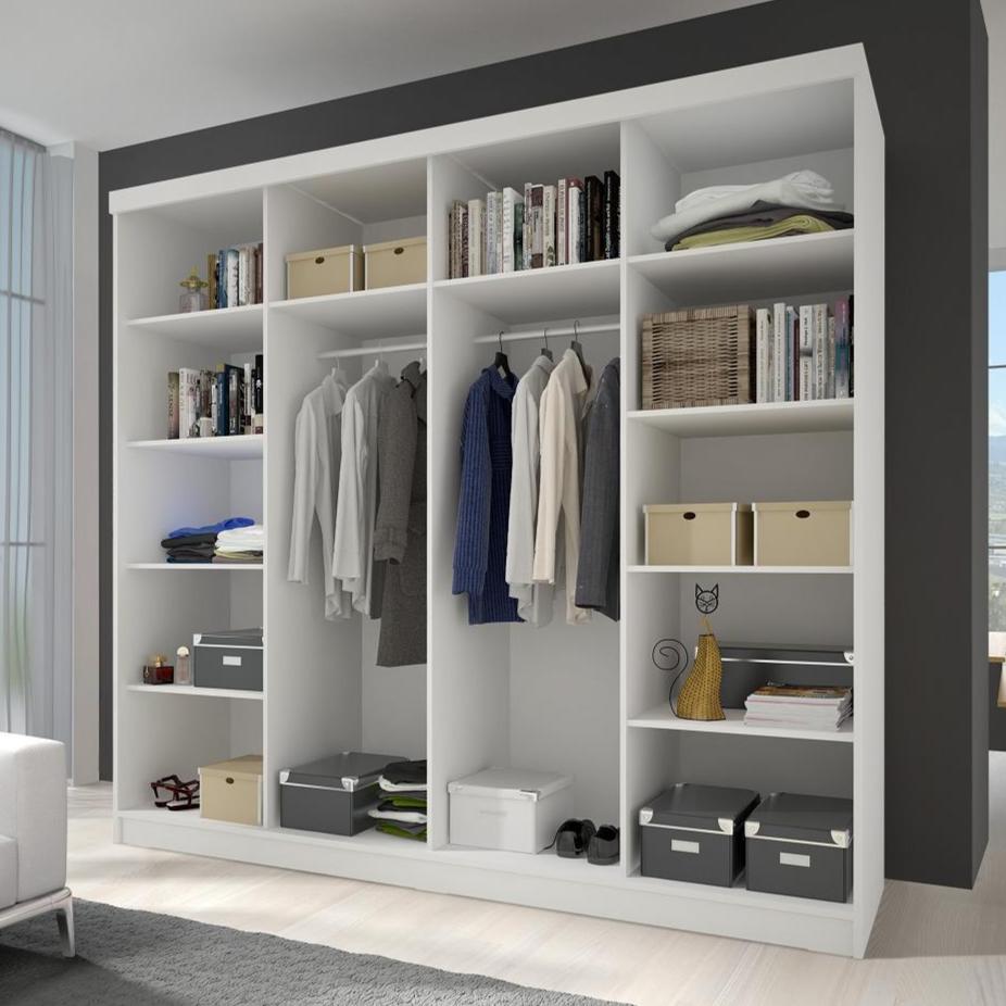 Modern wardrobe with clothes and storage boxes in a well-lit room.