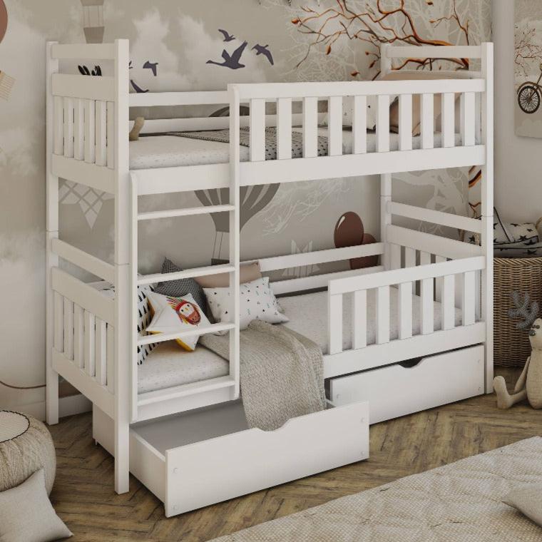 White wooden bunk bed with a pull-out drawer in a room setting.