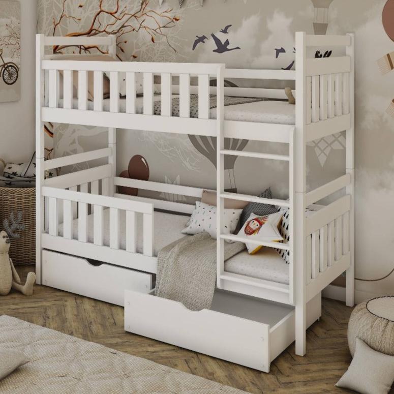 White bunk bed with a staircase in a room setting