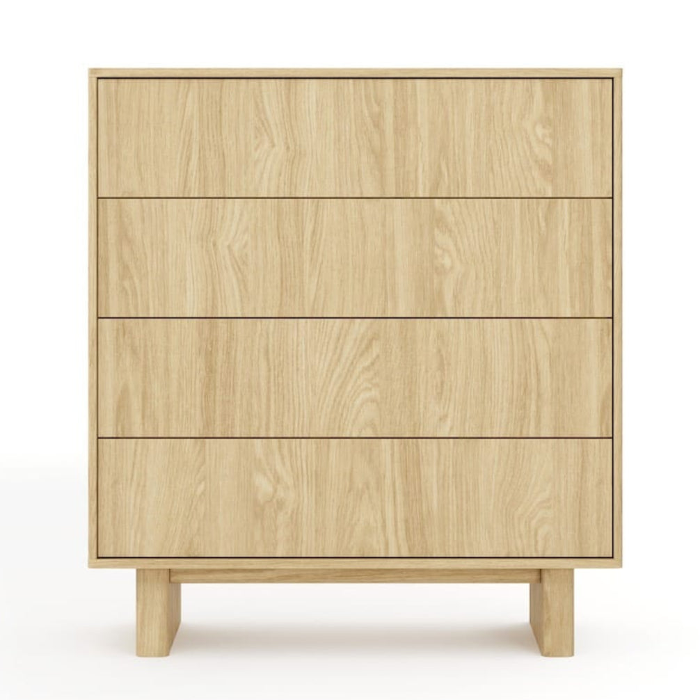 Wooden dresser with four drawers on a white background